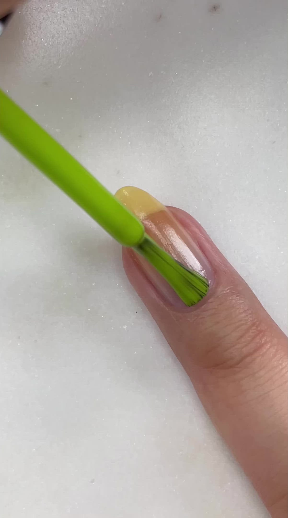 video of fair skin hand model painting nails with nail lacquer showing smooth application and finished product