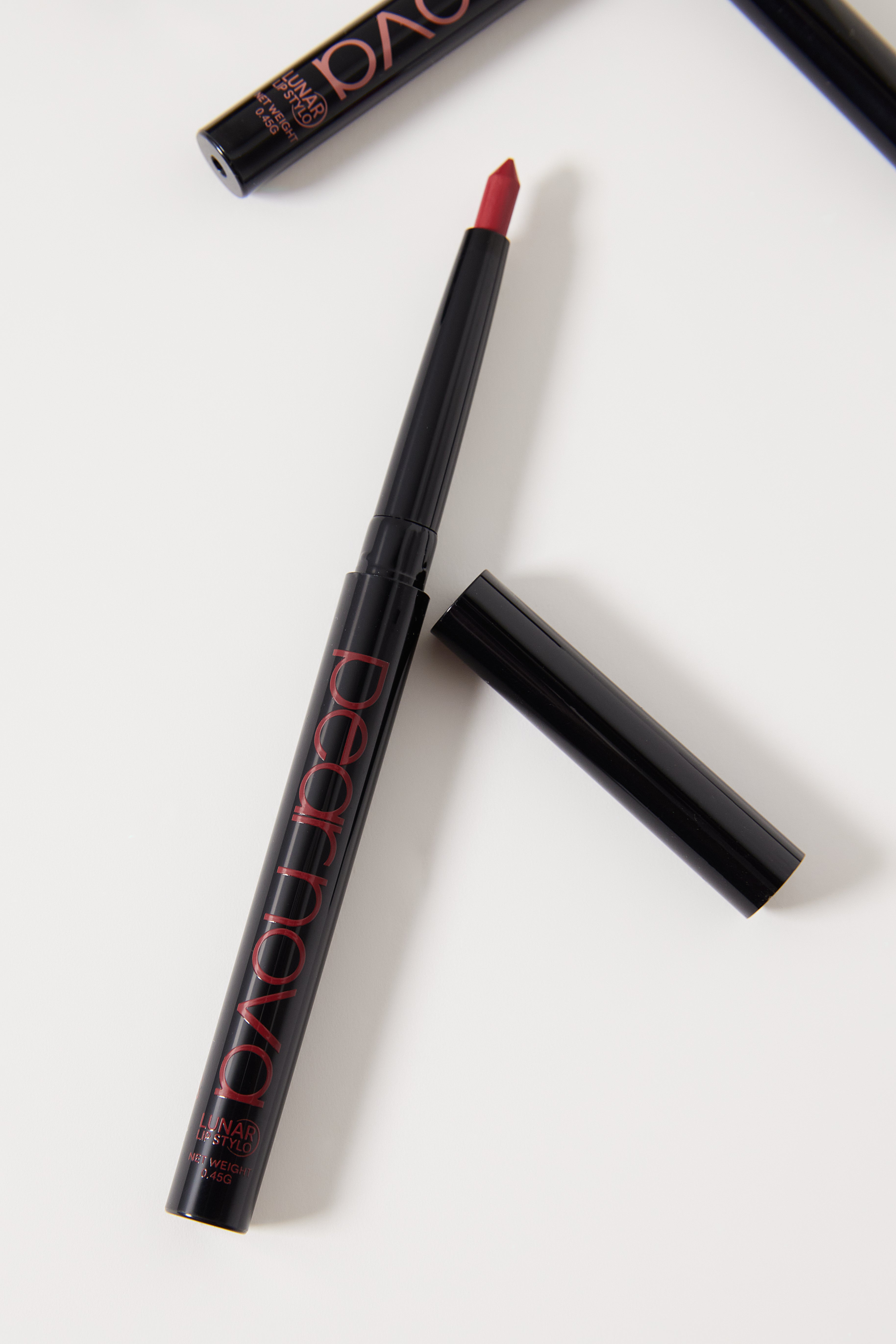Rocket Ship Lunar Lip Stylo with cap off showing lip liner