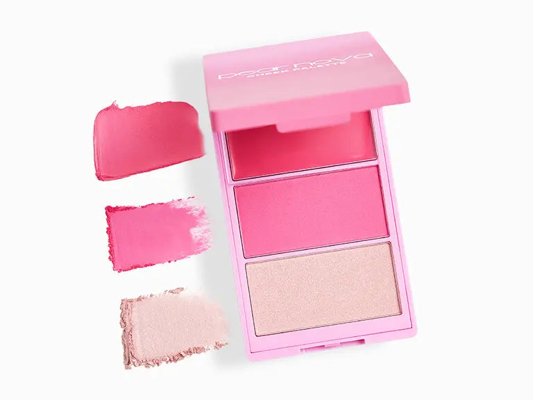 Pink makeup palette with swatches on a white background
