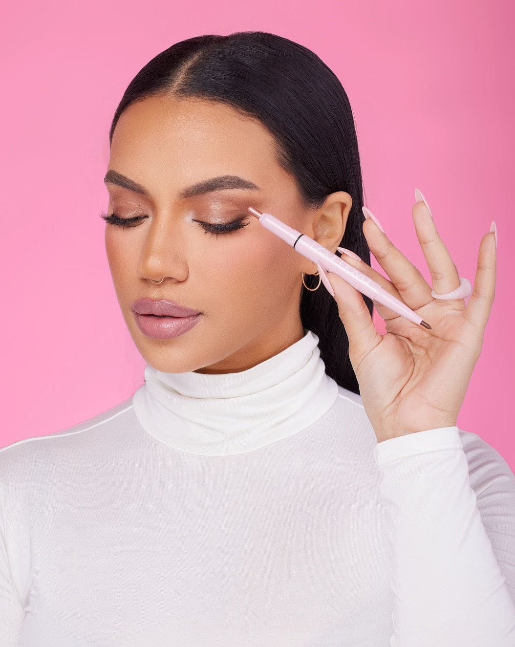 Model applying Rose Quartz eyeshadow stick