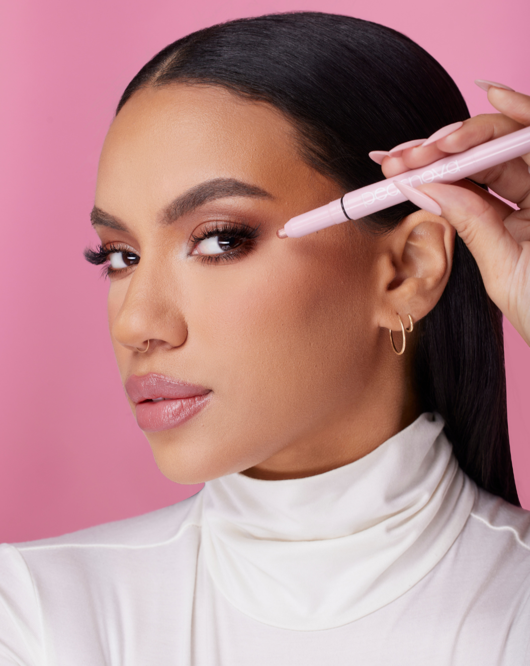 Model applying Rose Quartz eyeshadow stick