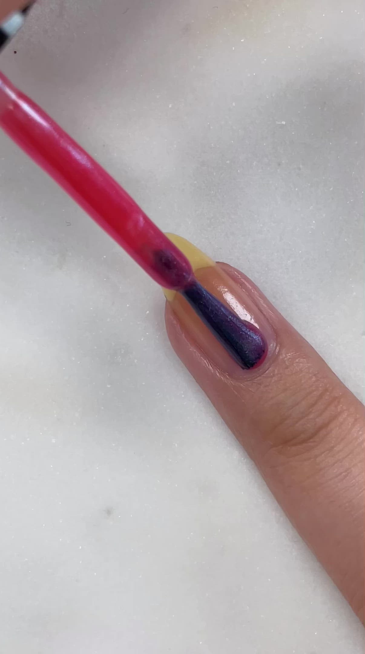 video of fair skin hand model painting nails with nail lacquer showing smooth application and finished product