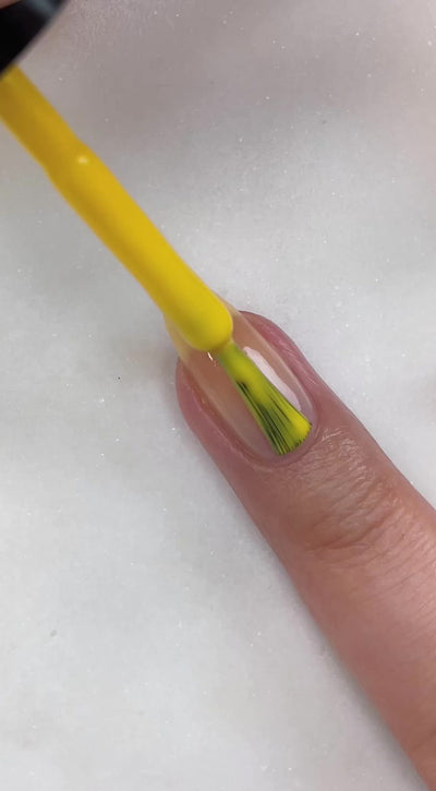 video of fair skin hand model painting nails with nail lacquer showing smooth application and finished product