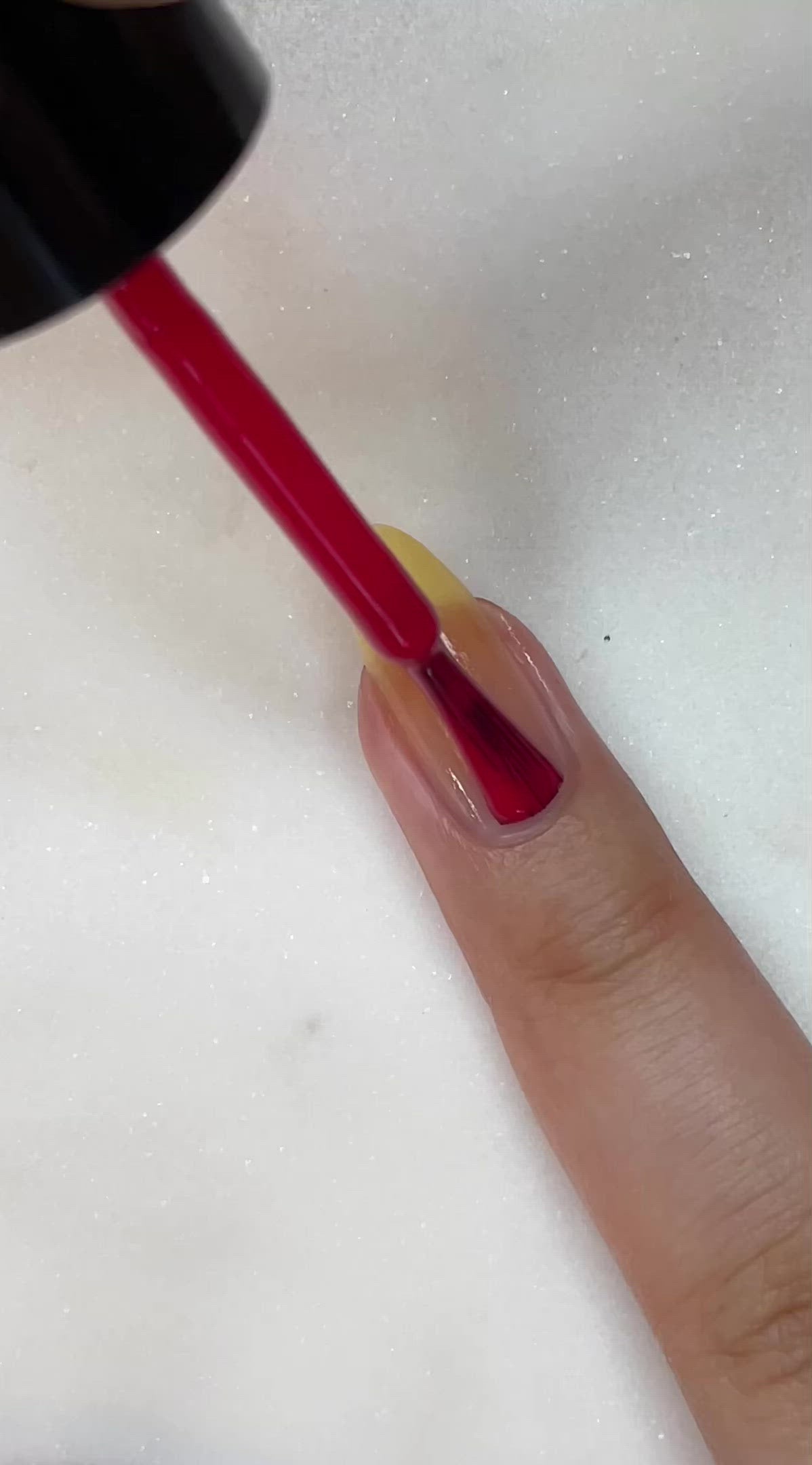 video of fair skin hand model painting nails with Berry Jane nail lacquer