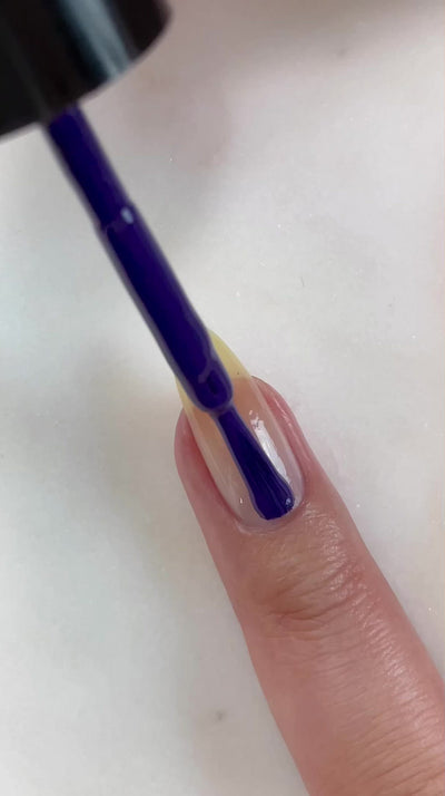 video of fair skin hand model painting nails with Beaucoup Bougie Classic Nail Lacquer