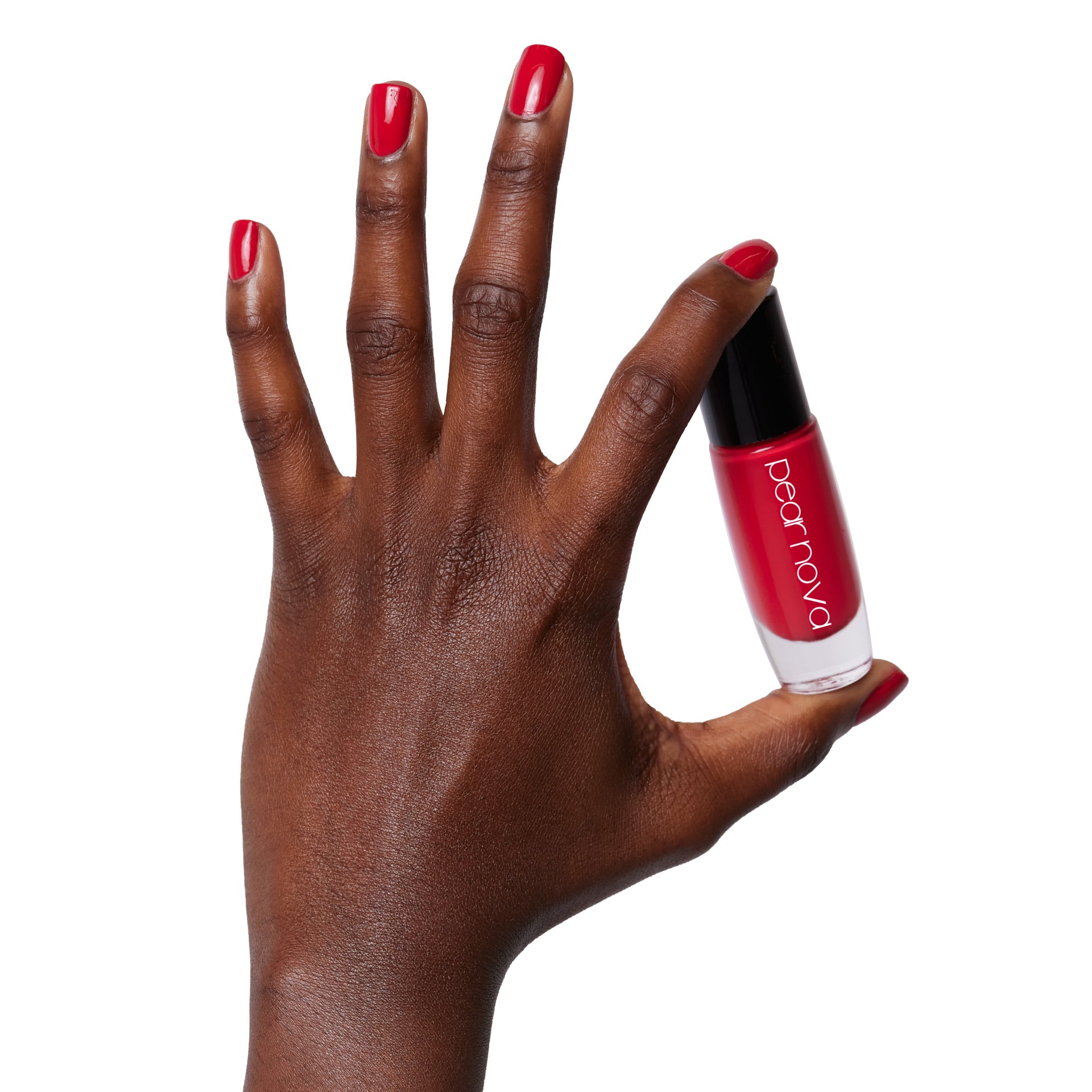 brown skin hand model holding bottle of nail lacquer with Berry Jane painted nails 