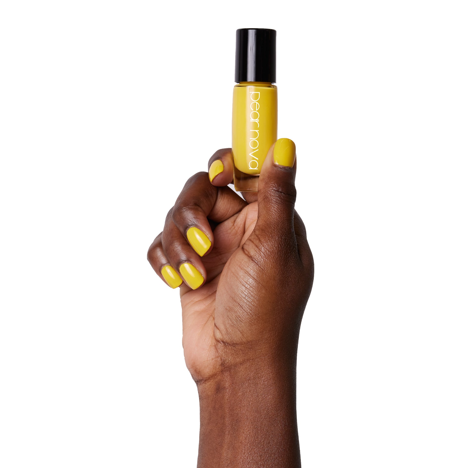brown skin hand model holding bottle of nail lacquer with Lemon Drop Logic painted nails 