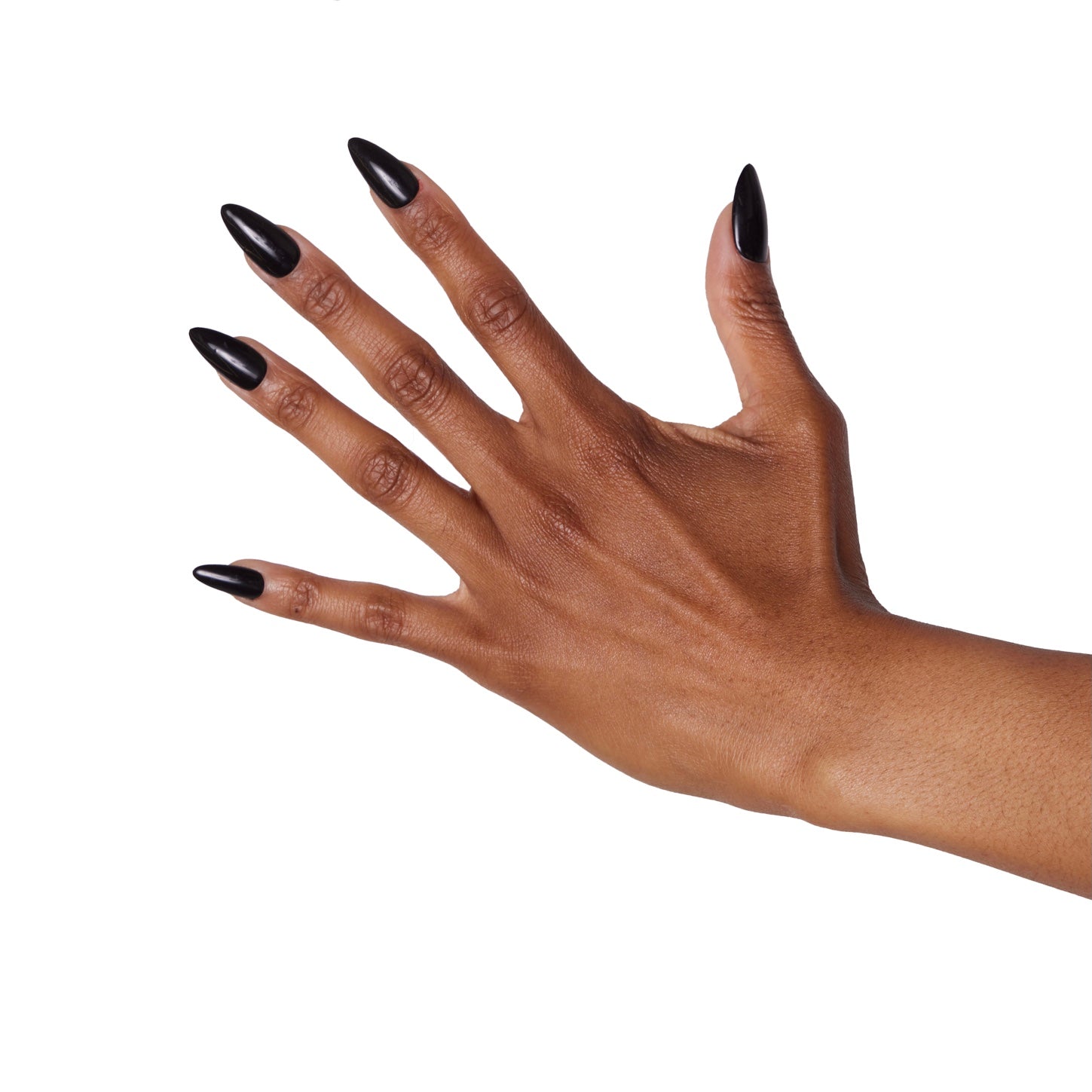 brown hand with long almond shaped black nails