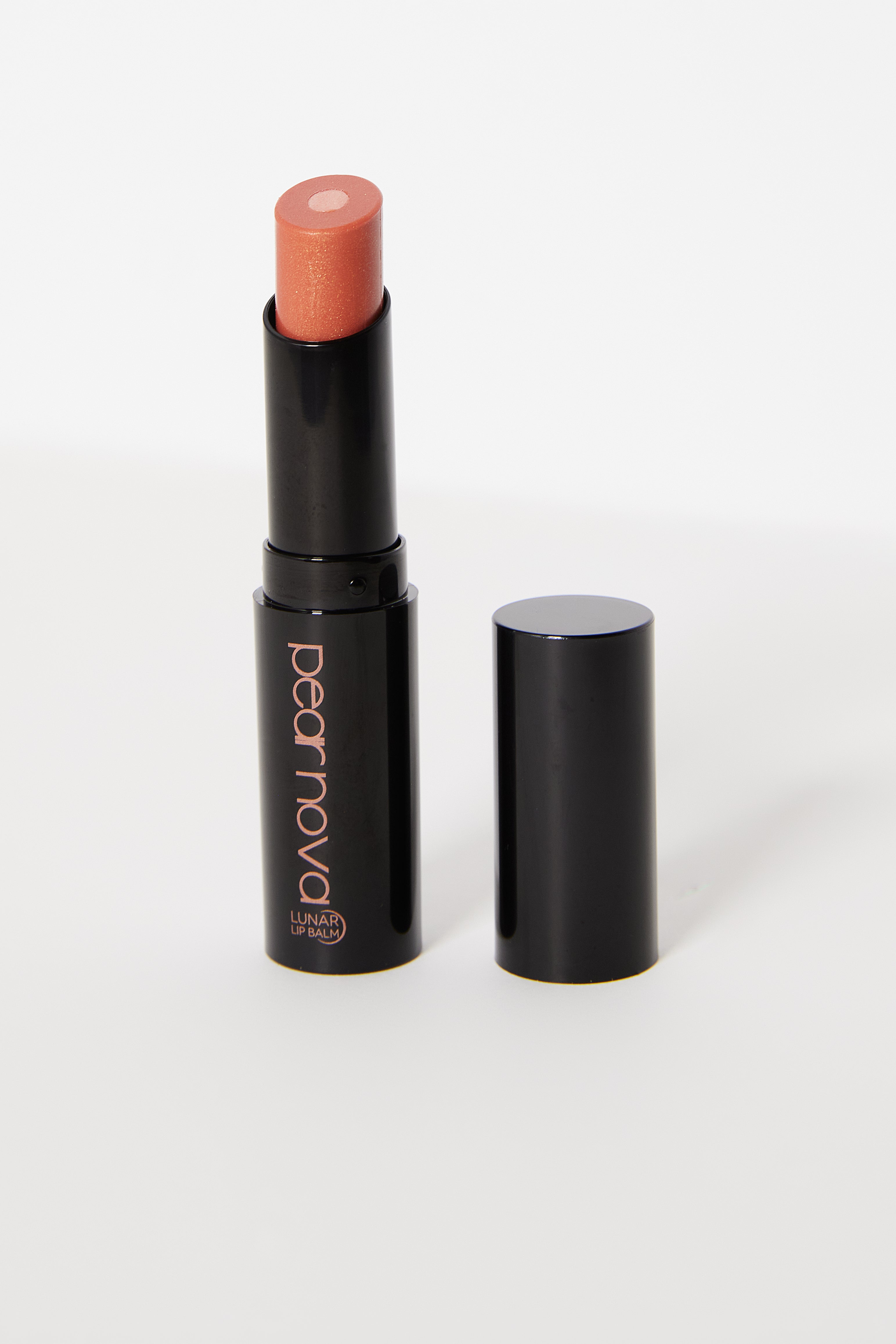 Orbit Lip balm with cap off showing moisturizing balm and shimmery inner core